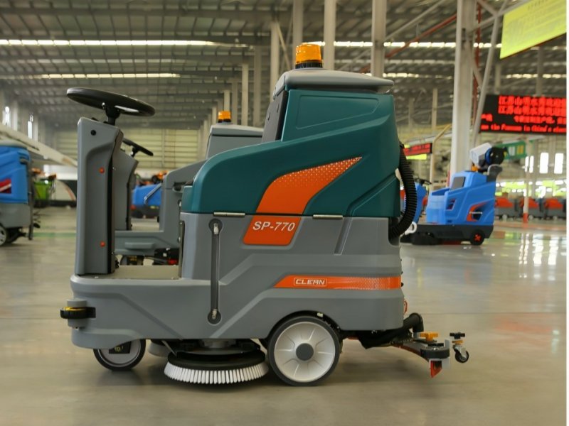 Ride-on industrial floor scrubber machine