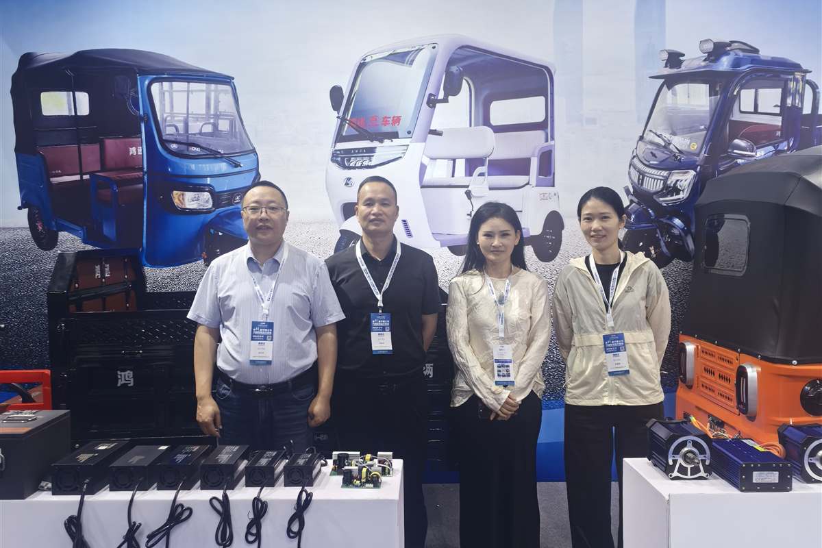 Uzen EV team at an industry exhibition